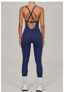 Detail of navy blue yoga bodysuit featuring criss-cross back straps and adjustable buckles