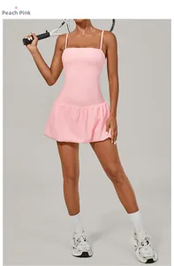 Peach pink sleeveless tennis dress with bubble hem and built-in shorts for yoga