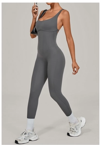 Detail of dark grey yoga jumpsuit with adjustable straps and structured waist stitching