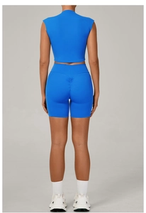 Detail view of high-waist blue yoga shorts featuring ruched butt lifting design