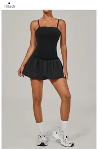 Close-up of black sleeveless golf dress with pleated bubble hem and slimming fit design