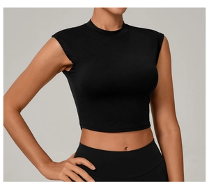 Close-up of slim fit black yoga top featuring breathable quick-dry fabric and crew neck