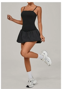 Detail of black sleeveless golf dress with flared skirt and built-in shorts for sports