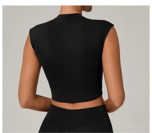 Back view of tight-fitting black yoga crop top with stand collar and small flutter sleeves