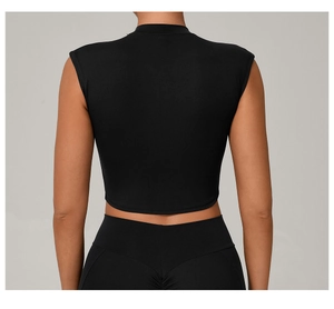 Rear view of black cropped yoga top with high neck and slim fit athletic silhouette