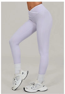 Detail view of high waist crossover lilac yoga leggings with premium stretch fabric