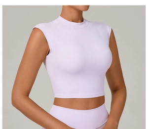 Detail of the slim fit high-neck lavender athletic crop top showing fabric texture