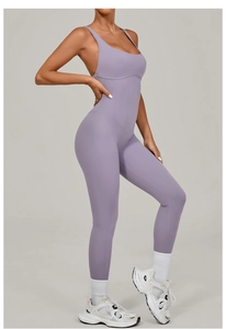 Detail shot of purple yoga jumpsuit showing slim fit cut and vertical seam design