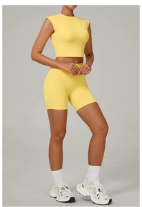 Detailed close-up of lemon yellow yoga set showing the seamless elastic fabric and high waist fit