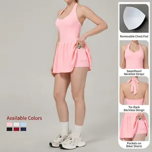 Pink halter backless tennis dress with built-in shorts and pockets for outdoor sports