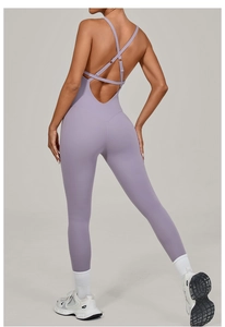 Detail of cross-strap back design on purple yoga jumpsuit with high-elastic breathable fabric