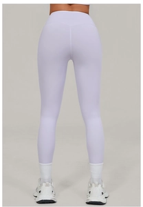 Rear view of high-waisted lilac yoga leggings showing butt lifting effect and slim fit