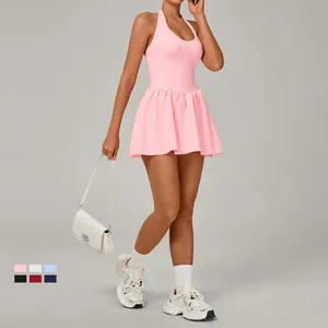 Pink halter neck tennis dress with built-in shorts for outdoor sports and fitness training