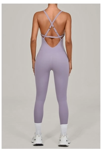 Detail view of light purple yoga jumpsuit featuring criss-cross back and adjustable straps