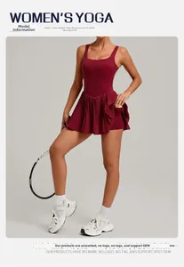 Detail of burgundy backless pleated tennis dress featuring built-in shorts and ball pocket