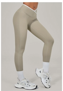Detail view of high-waist yoga leggings featuring a V-shaped crossover waistband design