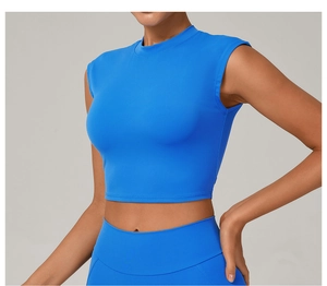 Close-up of bright blue moisture-wicking cropped yoga top with high-neck sleeveless cut