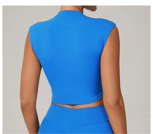 Detail of blue backless crop top and high waist leggings showing back fit and seam quality
