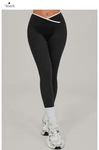 Detail of high waisted yoga leggings with cross V-waist and white contrast trim