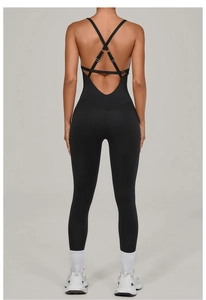 Detail of black cross-back yoga bodysuit featuring U-shape open back and slim straps