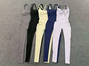 Detailed flat lay of yoga jumpsuits with adjustable crisscross back and ruched waist