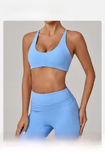 Close-up of moisture-wicking light blue yoga bra with twist back and slim-fit yoga pants