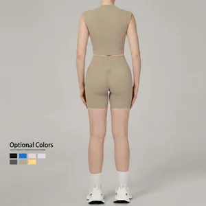 Women's beige high-neck yoga set featuring scrunch butt shorts and sleeveless crop top