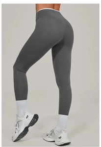 Detail of high-waisted dark grey yoga pants showing brushed texture and butt-lifting effect