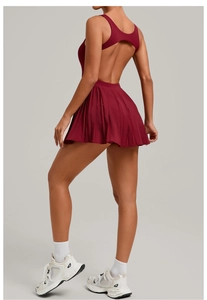 Detail of burgundy backless sports dress with pleated skirt for tennis and fitness
