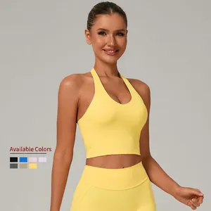 Set yoga giallo da donna con reggiseno sportivo allacciato al collo e leggings a vita alta