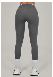 Rear view of dark grey high-waisted yoga leggings showing the butt-lifting compression fit