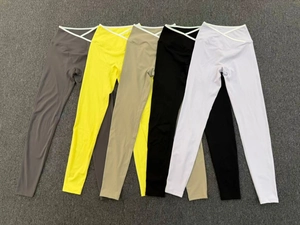 Detailed flat lay of high waist cross waist yoga leggings in five assorted colors