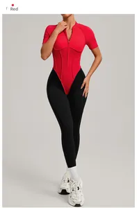 Macro detail of red short-sleeved zipper top and black compression leggings fitness jumpsuit
