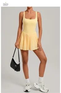 Detail view of Durian Yellow pleated tennis dress featuring high-elastic quick-dry fabric