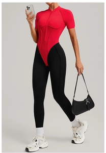 Close-up of contrast color fitness catsuit with stand collar and zipper detail