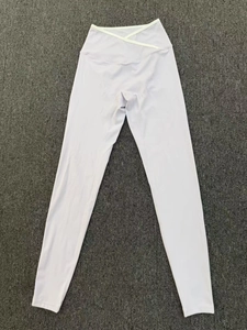 Close-up of the cross-over V-waist design on lilac purple high-waisted yoga leggings