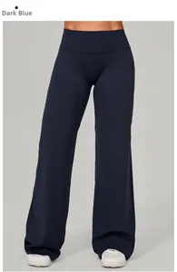 Détail du pantalon de yoga taille haute à jambes larges en tissu technique bleu canard