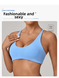 Detail of light blue sports bra with a low U-neck design and snug fit fabric