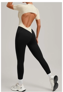 Detail of moisture-wicking yoga jumpsuit with back cutout and contrast color stitching