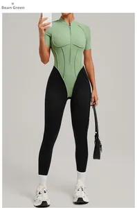 Detail of pea green half-zip stand collar top with black slim fit sports yoga leggings