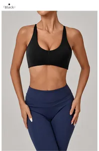 Close-up of black knot-back sports bra with wide straps and elasticated ribbed waistband