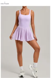 Detailed view of lilac purple pleated hem on backless athletic tennis dress with soft stretch