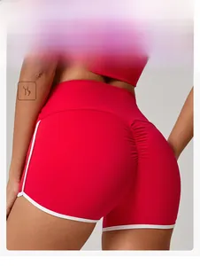 Detailed close-up of high-waist scrunch butt yoga shorts with white piping and peach lifting