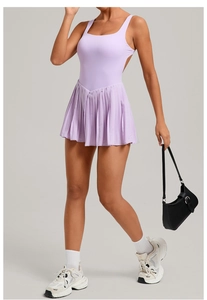 Detail view of light purple backless tennis dress with pleated hem for athletic wear