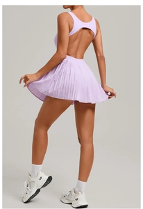 Detail view of backless lavender tennis dress featuring cutout design and pleated skirt