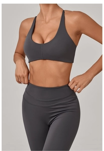 Detail of dark grey yoga set with racerback sports bra and high waisted compression leggings