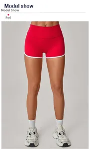 Detail of red and white high-waisted yoga shorts with slimming peach butt lift fit