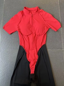 Detail view of contrast color athletic bodysuit with stand collar and front zipper closure