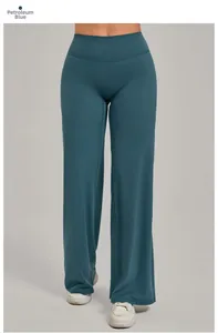Vue détaillée du pantalon de yoga taille haute bleu pétrole à jambe large et tissu fluide