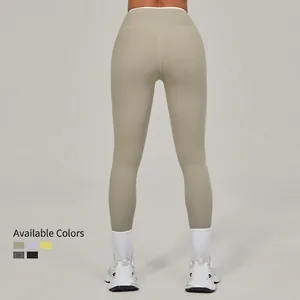 High-waist crisscross yoga leggings in sand grey with seamless high-stretch fit